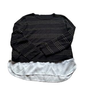 Black striped sweater with faux button up white blouse on bottom.
